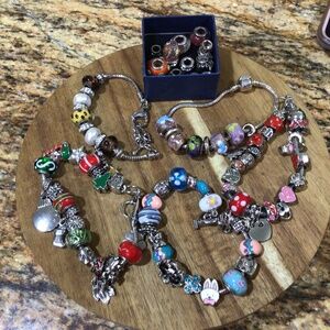 Lot of 5 colorful charm bracelets with extra charms.